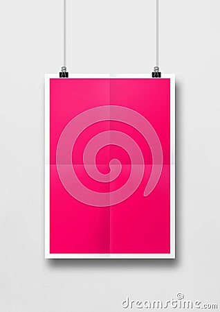Pink folded poster hanging on a white wall with clips Stock Photo