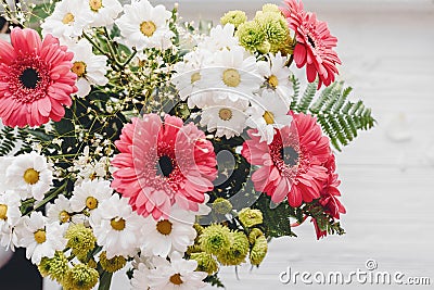 Pink gerbera,white daisy and green chrysanthemum in beautiful br Stock Photo