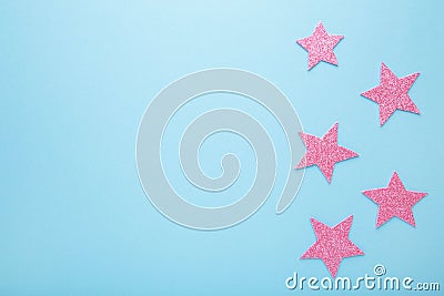 Pink glittering star on pink background, top view Stock Photo