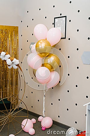 Pink and gold balloons in the design of the children`s birthday photo zone Stock Photo