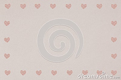 Pink heart patterned frame on a light brown background Stock Photo