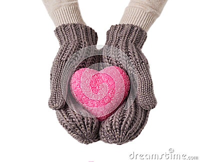 Pink heart in wool gloves Stock Photo