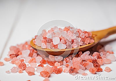 Pink himalaya salt in wooden spoon Stock Photo