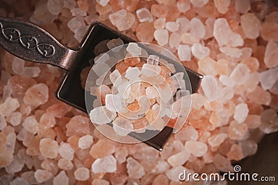 Pink Himalayan edible salt and spice spoon. Stock Photo