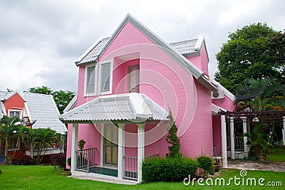 Pink house in forest Stock Photo