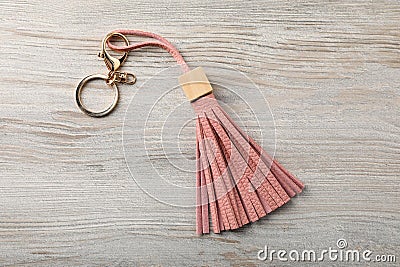 Pink leather keychain on light wooden background, top view Stock Photo