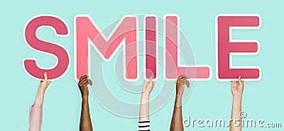 Pink letters forming the word smile Stock Photo