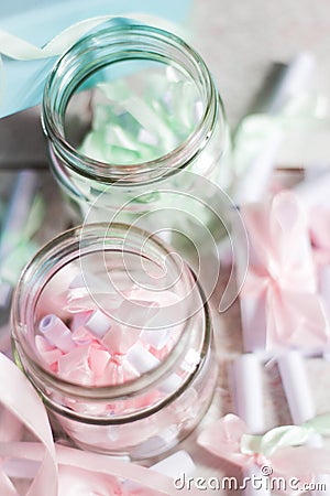 Small glass container with rolled paper on the inside Stock Photo