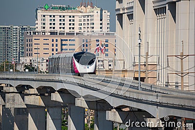 The Pink Line electric train runs on train track Editorial Stock Photo