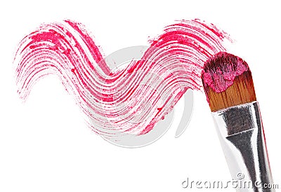 Pink lipstick stroke (sample) with makeup brush Stock Photo