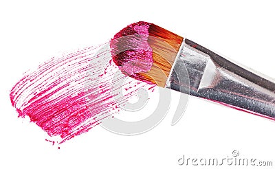 Pink lipstick stroke (sample) with makeup brush Stock Photo