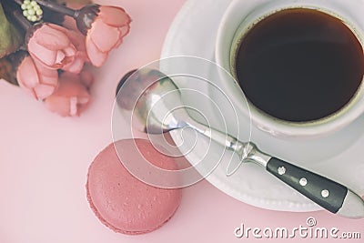 Pink macaron, macaroon, spring flowers and coffee, pastel background, top view. Romantic morning, gift for beloved Stock Photo