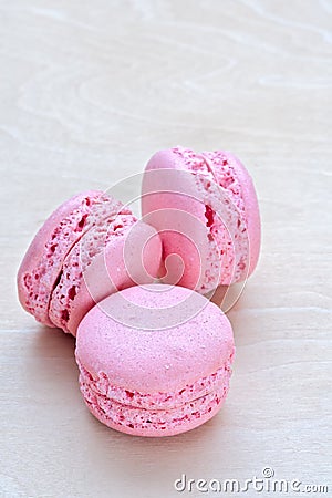 Pink macaron on wooden background Stock Photo