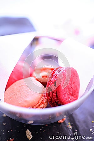 Pink macaroons in glass bowl Stock Photo