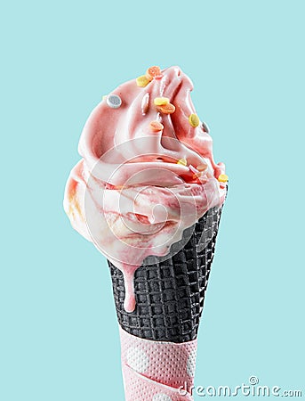 Pink melting ice cream in black waffle cone Stock Photo