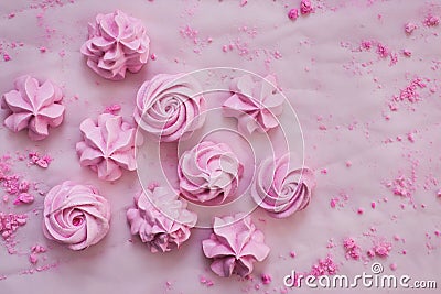 Pink meringues on plate, colorful background Stock Photo