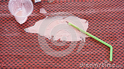 Pink milk spilled on the mat. Stock Photo