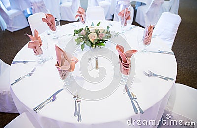 Pink napkins and white linens Stock Photo