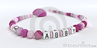 A pink pacifier chain for girls with name Abby Stock Photo