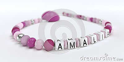 A pink pacifier chain for girls with name Amalia Stock Photo