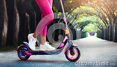 Pink Pants and a Black Scooter In The Park Stock Photo