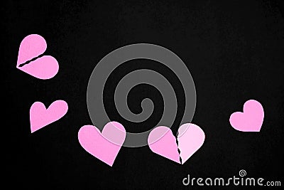Pink paper hearts on a black background and copy space Stock Photo