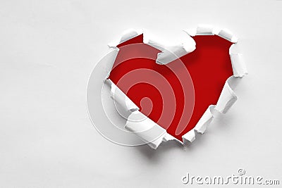 Pink paper teared in heart shape with black space for text, copy Stock Photo