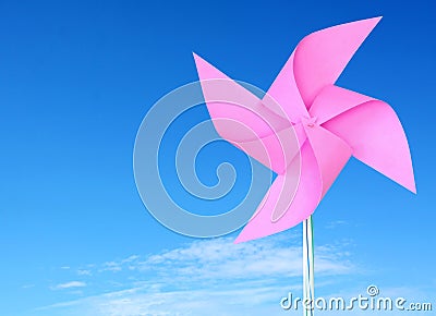 Pink paper windmill in the sky Stock Photo