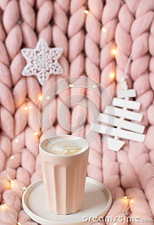 Pink pastel merino woolen giant blanket, gingerbread deer, cup with cappuccino, Christmas toy, New Year Stock Photo