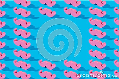 Pink pastel mustache pattern and copy space on a blue background. A symbol of father day Stock Photo