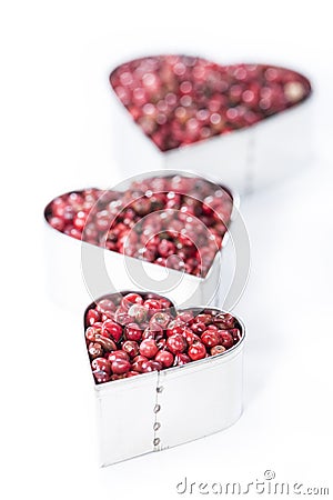 Pink Peppercorns Heart Shape (on white) Stock Photo