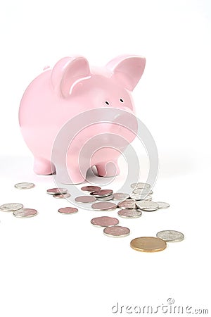 Pink Piggy Bank with coins Stock Photo