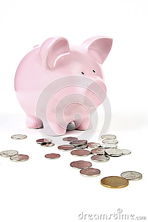 Pink Piggy Bank with coins Stock Photo