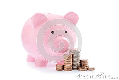 Pink piggy bank and Stacks of money coins Stock Photo