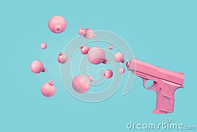 Pink pistol shooting Christmas ball bauble ornaments instead of bullets on pastel blue background Stock Photo