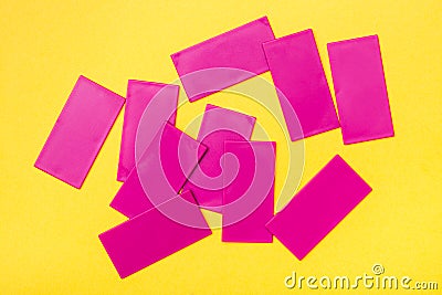 Pink plastic flat rectangles are scattered chaotically Stock Photo