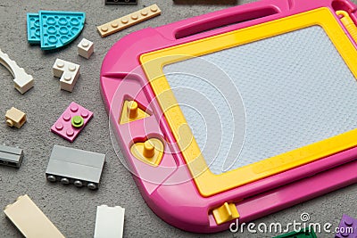 Pink plastic magnetic drawing board, toy for learning to draw Stock Photo