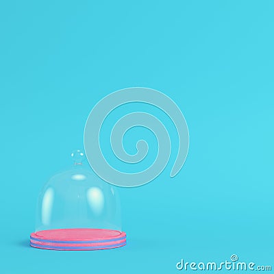 Pink plate with glass dome on bright blue background in pastel c Stock Photo