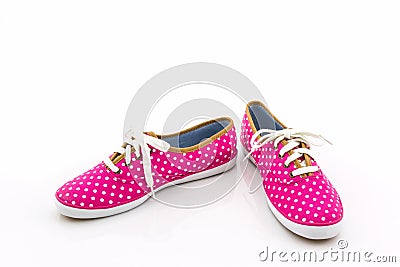 Pink polka dot canvas shoe. Stock Photo