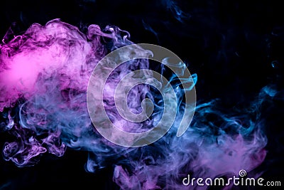 Of pink purple and blue wavy smoke on a black isolated background. Abstract pattern of steam from vape of rising clouds Stock Photo