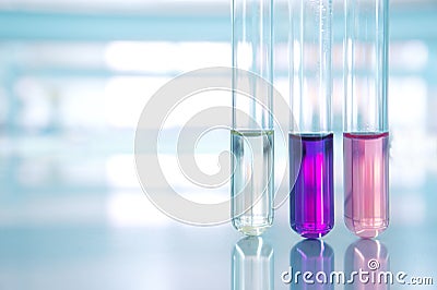 Pink purple water of three test tube in science laboratory Stock Photo