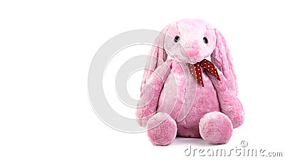 Pink rabbit doll with big ears isolated on white background. Cute stuffed animal and fluffy fur for kids Stock Photo