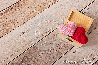 Pink and red hearts in tiny wooden treasure box. Minimal and simple love photo concept Stock Photo