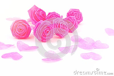 Pink rose fabric flower and small hart on white background for V Stock Photo