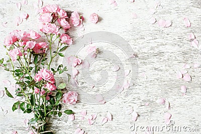 Pink rose flowers bouquet mockup on white rustic wooden background Stock Photo