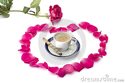 Pink rose lobes of roses and a cup of coffee at center Stock Photo