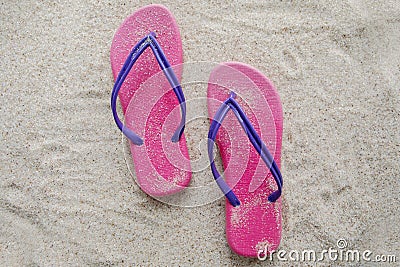 Pink sandal on sandy beach Stock Photo