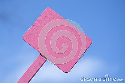 Pink Sign on Bright Blue Cloudy Sky Stock Photo