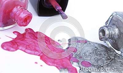 Pink and Silver Nail Polish on White Stock Photo