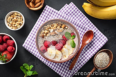 Pink smoothie bowl with raspberry banana Stock Photo